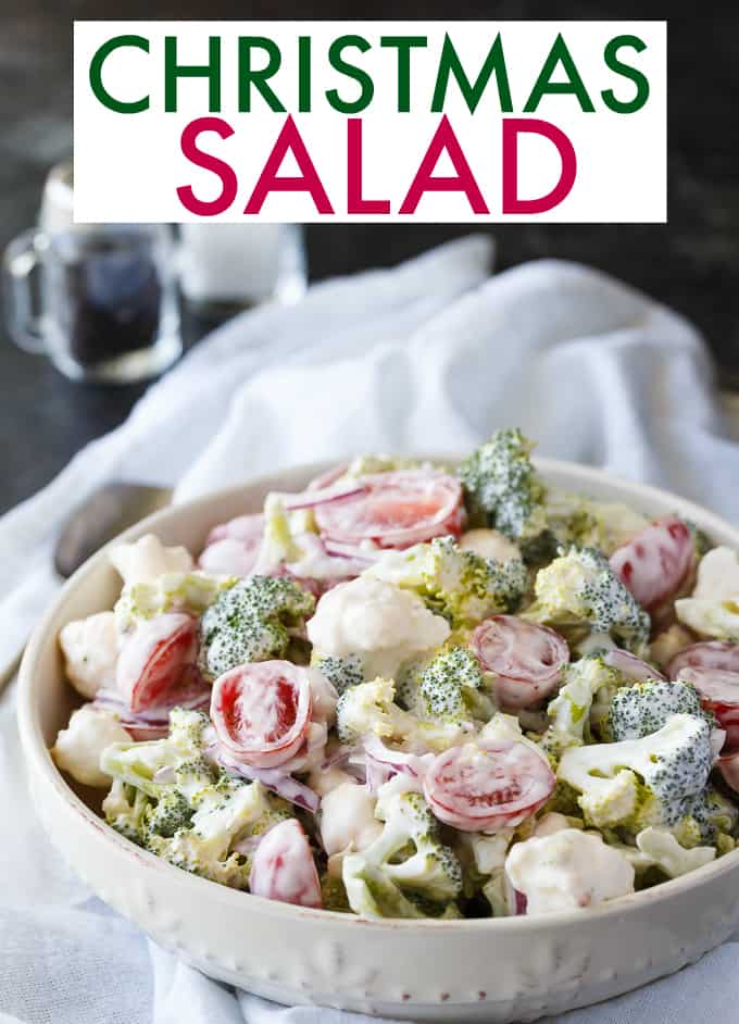 Christmas Salad - Contains all the colors of Christmas! This fresh, bright salad is made with broccoli, cauliflower, red onion and cherry tomatoes mixed with a creamy dressing.