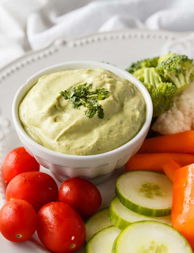 Cilantro Lime Avocado Yogurt Dip - This healthy veggie dip is as creamy as it is delicious! Packed with lime juice, Greek yogurt, avocado, cilantro, and a touch of chili powder.