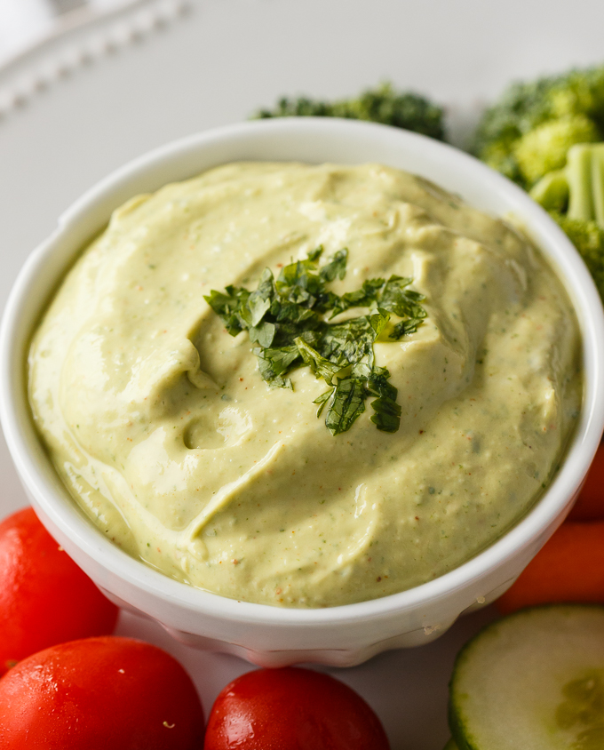 Cilantro Lime Avocado Yogurt Dip - This healthy veggie dip is as creamy as it is delicious! Packed with lime juice, Greek yogurt, avocado, cilantro, and a touch of chili powder.