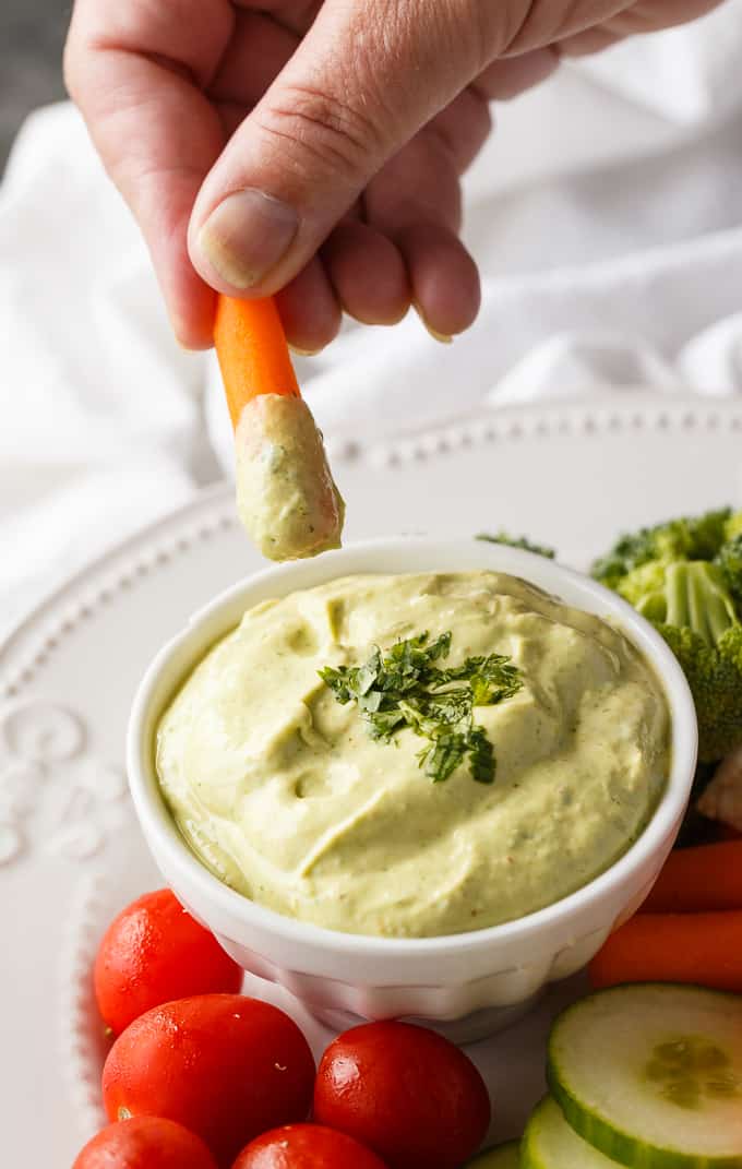 Cilantro Lime Avocado Yogurt Dip - This healthy veggie dip is as creamy as it is delicious! Packed with lime juice, Greek yogurt, avocado, cilantro, and a touch of chili powder.