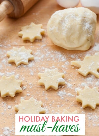 raw christmas cookies on a cutting board