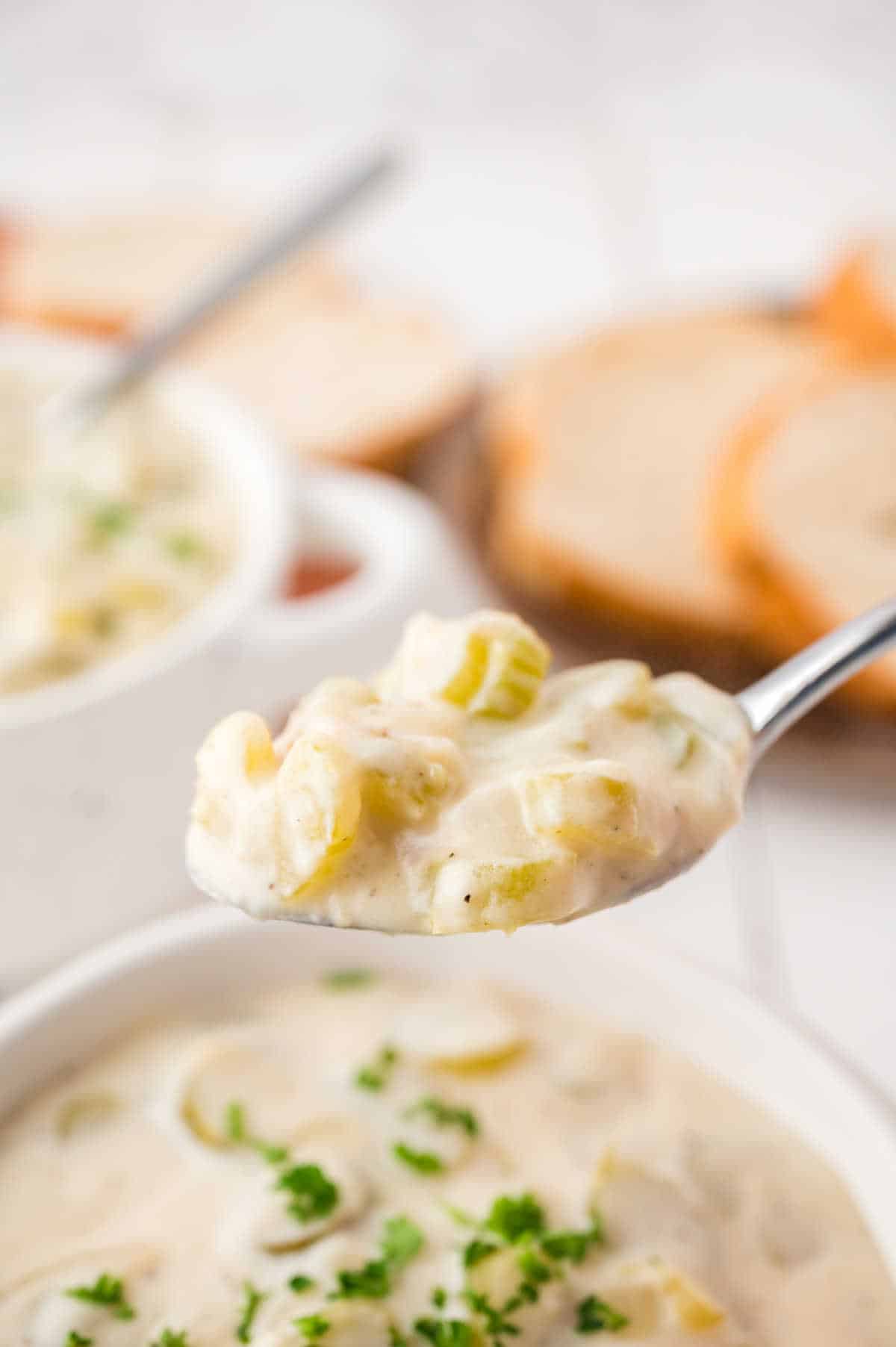 Cream of celery soup on a spoon.