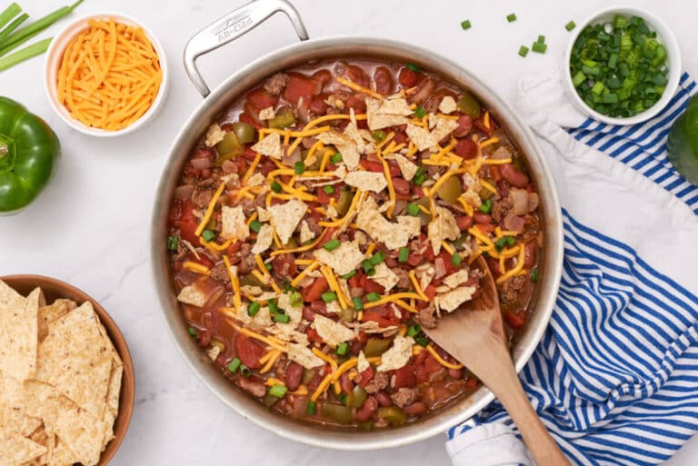 Texas beef skillet in a pan with a wooden serving spoon.