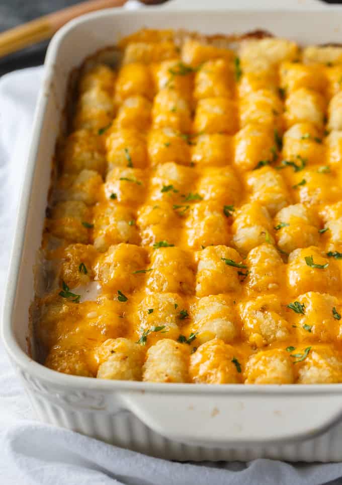 Tater Tot Casserole - A classic comfort food casserole your family will love! It has a layer of ground beef mixed with a creamy veggie sauce and topped with crispy Tater Tots and melted cheddar cheese.