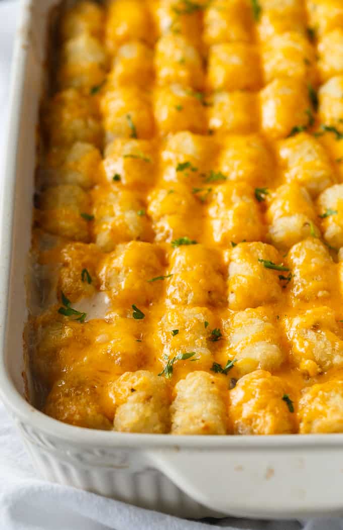 Tater Tot Casserole - A classic comfort food casserole your family will love! It has a layer of ground beef mixed with a creamy veggie sauce and topped with crispy Tater Tots and melted cheddar cheese.