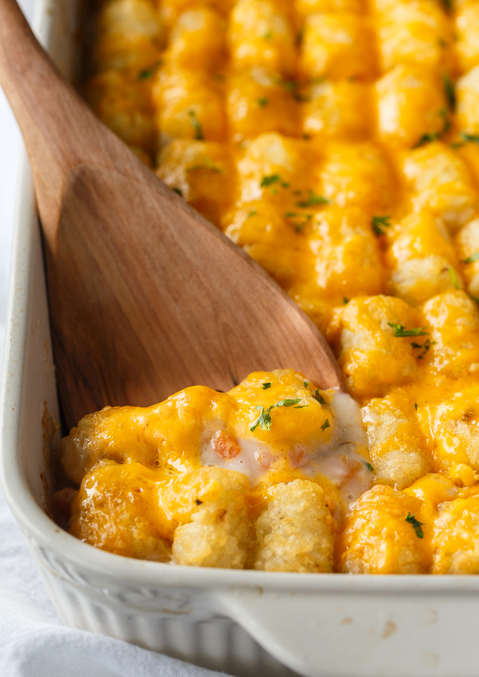 Tater Tot Casserole - A classic comfort food casserole your family will love! It has a layer of ground beef mixed with a creamy veggie sauce and topped with crispy Tater Tots and melted cheddar cheese.