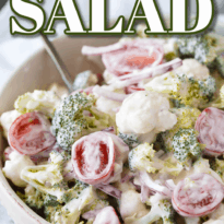 Christmas Salad - Contains all the colors of Christmas! This fresh, bright salad is made with broccoli, cauliflower, red onion and cherry tomatoes mixed with a creamy dressing.