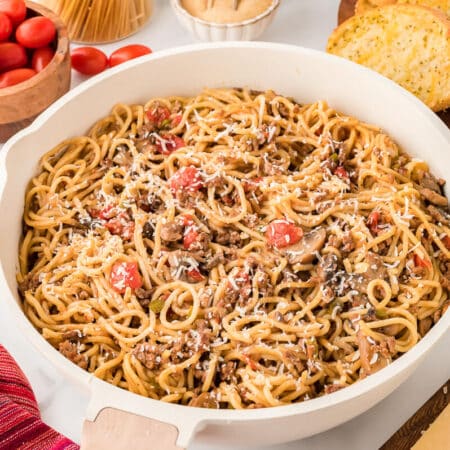 Spaghetti in a white pan.