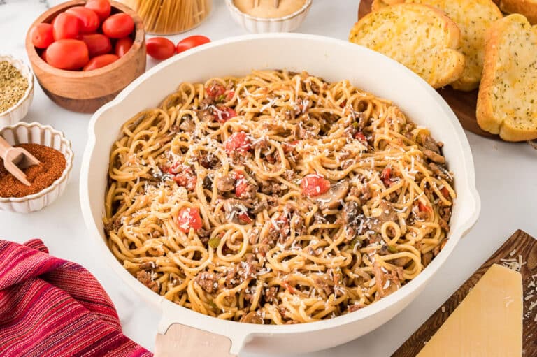 Spaghetti in a white pan.