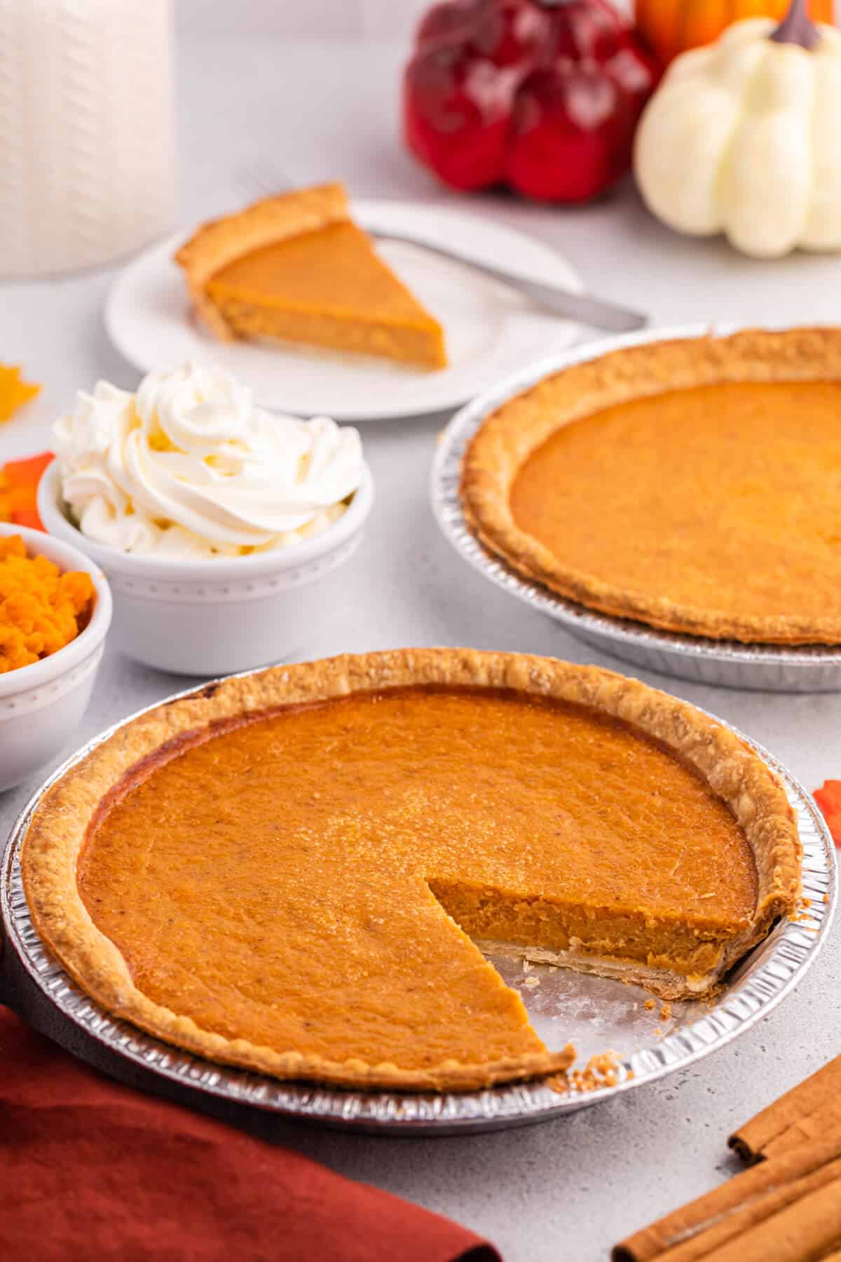 Sweet potato pie with a slice cut out.