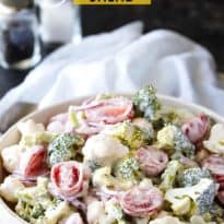 Christmas Salad - Contains all the colors of Christmas! This fresh, bright salad is made with broccoli, cauliflower, red onion and cherry tomatoes mixed with a creamy dressing.