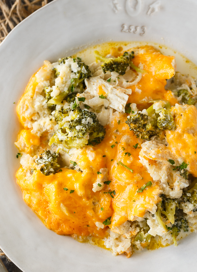 Low Carb Chicken Divan - This comforting casserole has a creamy sauce made with chicken, broccoli, cheddar cheese and cauliflower rice. You won't even miss the extra carbs.