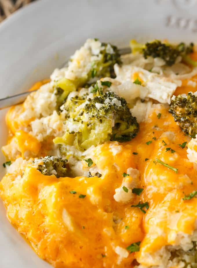 Low Carb Chicken Divan - This comforting casserole has a creamy sauce made with chicken, broccoli, cheddar cheese and cauliflower rice. You won't even miss the extra carbs.