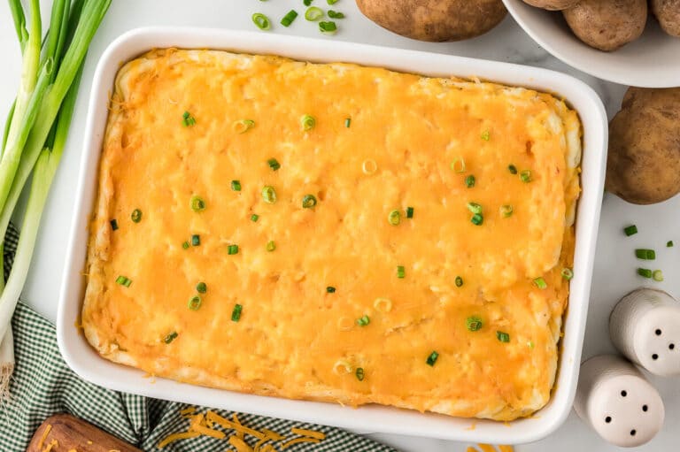 Mashed potato casserole in a white pan.