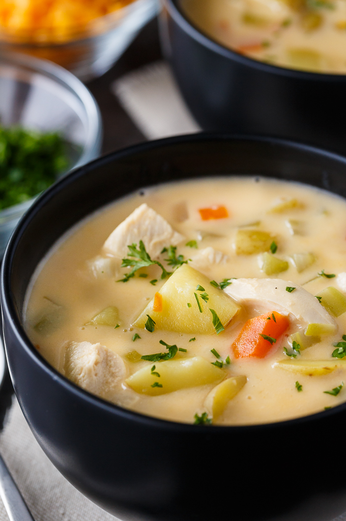 Cheesy Chicken Chowder - Hearty and delicious! This creamy chowder is loaded with chicken, potatoes, carrots and lots of cheese.