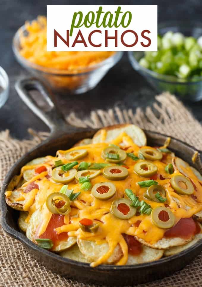 Potato Nachos - Crispy, flavorful potatoes loaded with taco sauce, green olives, green onions and lots of melty cheddar cheese. The perfect appetizer!