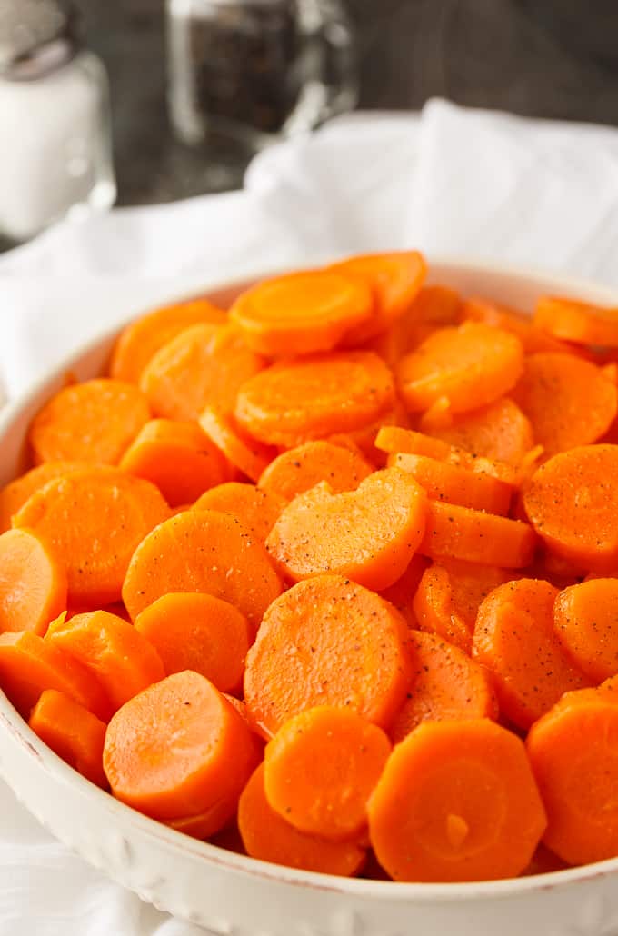 Sweet and Sour Carrots - Try a new carrot recipe for the holiday season! This sweet veggie is made better with brown sugar, lemon juice, and butter.