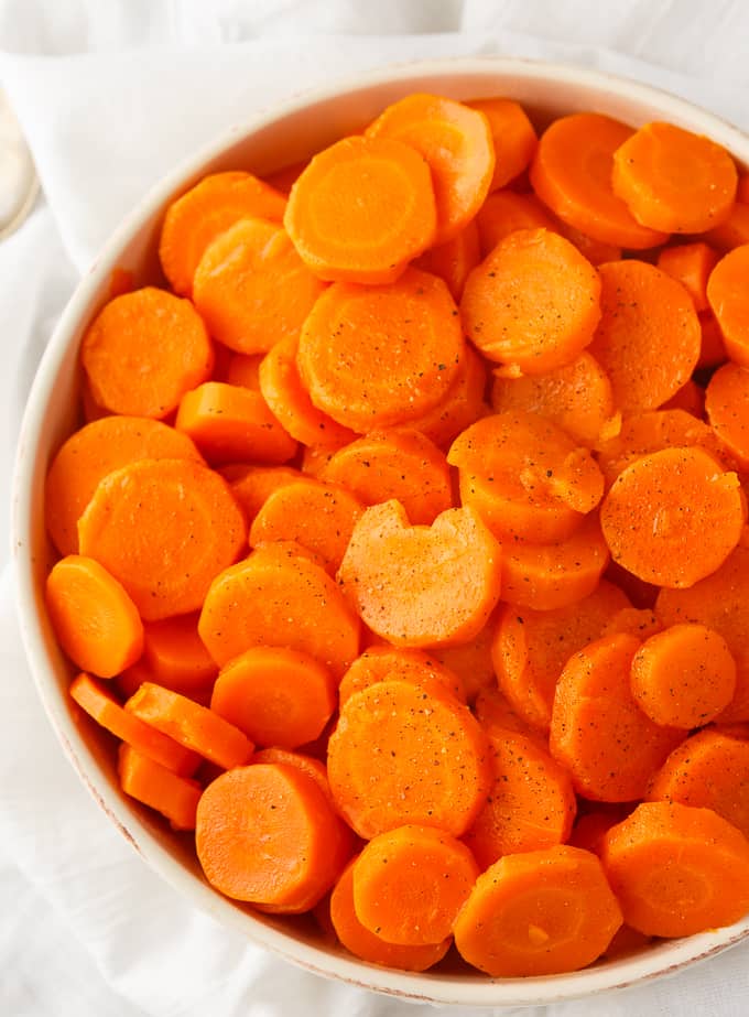 Sweet and Sour Carrots - Try a new carrot recipe for the holiday season! This sweet veggie is made better with brown sugar, lemon juice, and butter.