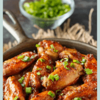 Oven Baked Chicken Wings - The BEST wing recipe ever! Juicy chicken wings are oven baked in a flavorful honey garlic sauce.