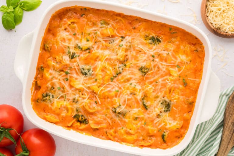 Tortellini casserole in a white casserole dish.