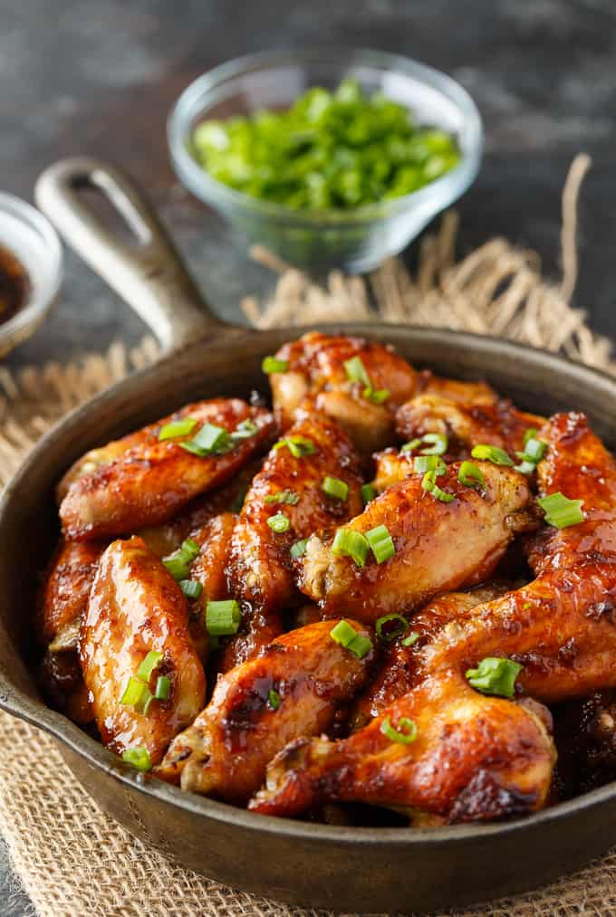 Oven Baked Chicken Wings - The BEST wing recipe ever! Juicy chicken wings are oven baked in a flavorful honey garlic sauce.