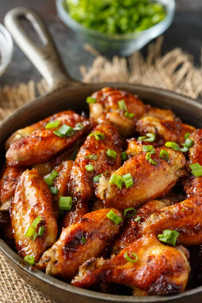 Oven Baked Chicken Wings - The BEST wing recipe ever! Juicy chicken wings are oven baked in a flavorful honey garlic sauce.