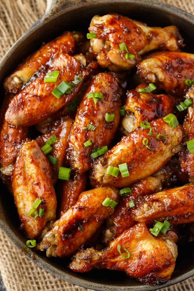 Oven Baked Chicken Wings - The BEST wing recipe ever! Juicy chicken wings are oven baked in a flavorful honey garlic sauce.