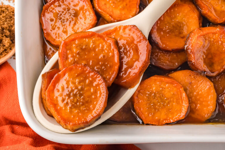 The recipe on a serving spoon in a casserole dish.