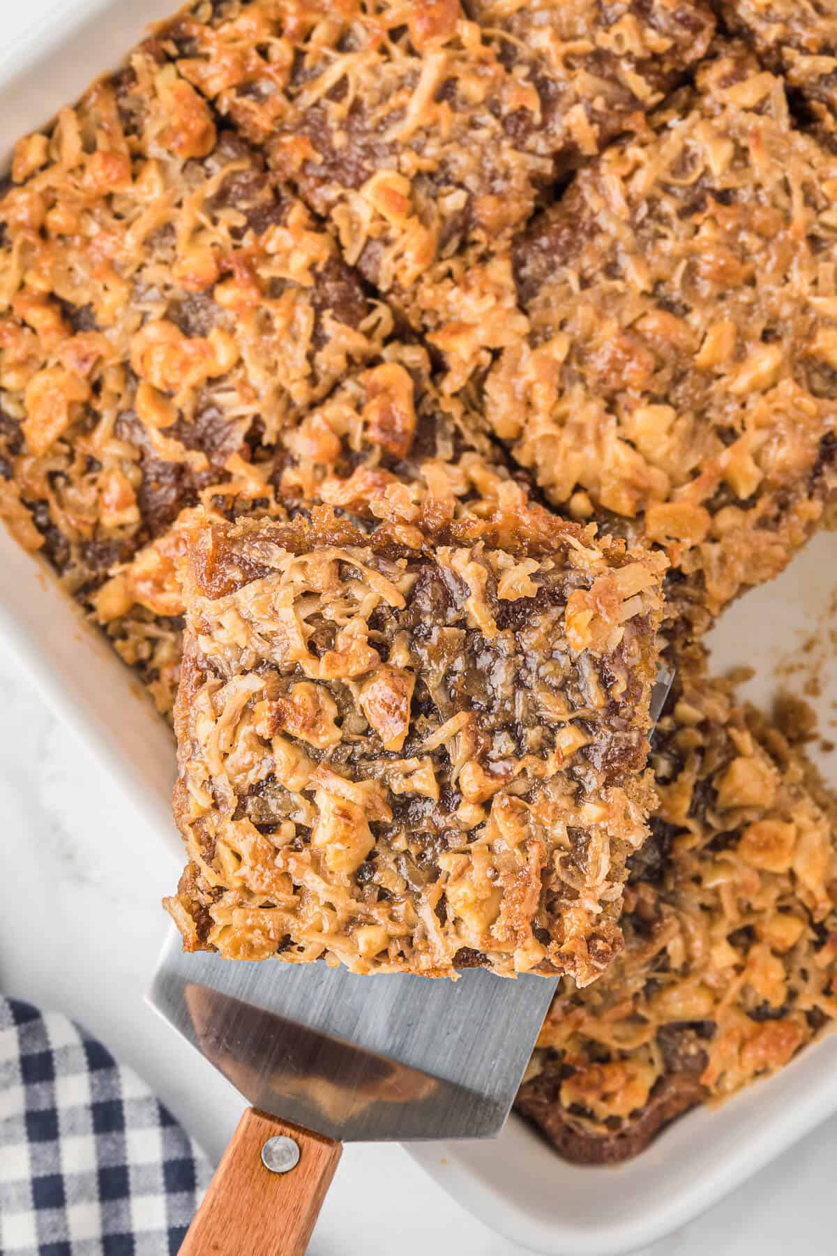 A serving spatula with a slice of oatmeal cake.