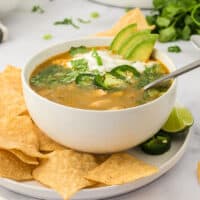 White chicken chili in a bowl with a spoon.