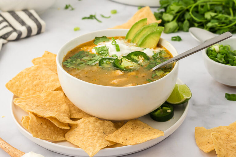 White chicken chili in a bowl with a spoon.