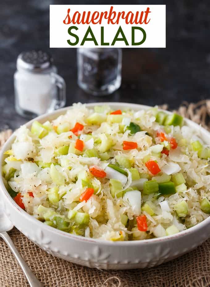 Sauerkraut Salad - Tangy and sweet! This delicious salad recipe has crisp veggies, sauerkraut tossed in a sweet dressing. Delish!