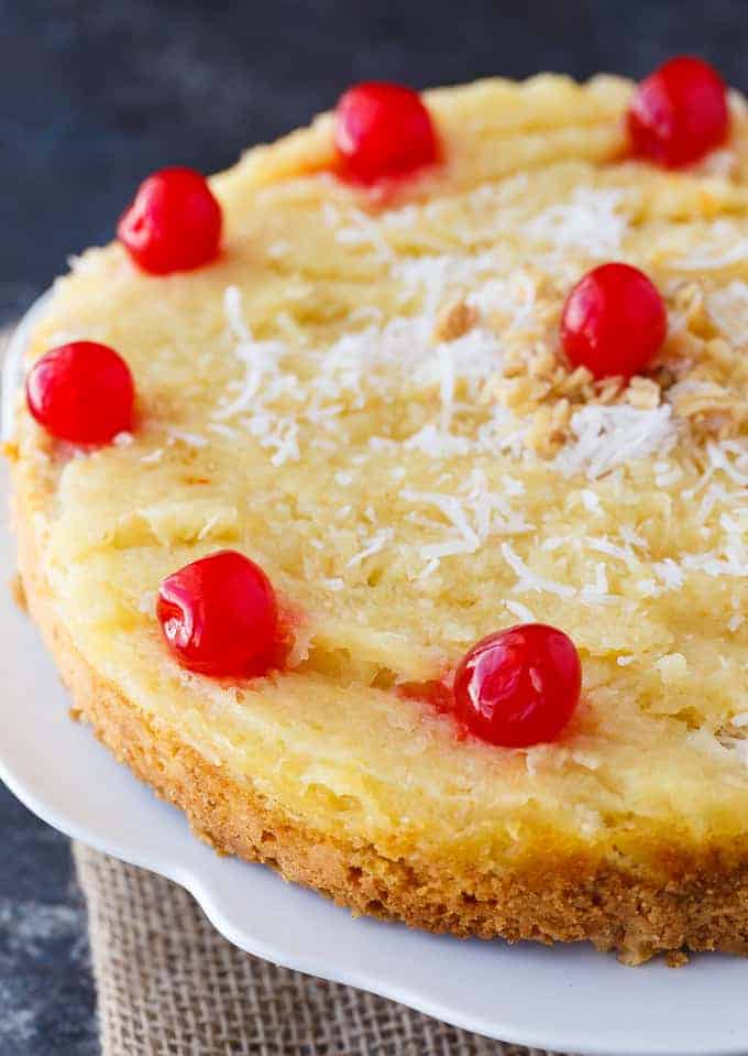 Fool's Cake - A simple, fool-proof cake everyone loves! This yummy dessert has layers of walnuts, yellow cake, coconut and pineapple. Perfect for potlucks!