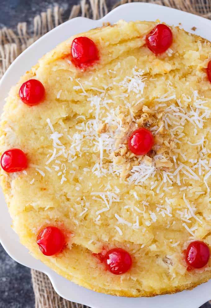 Fool's Cake - A simple, fool-proof cake everyone loves! This yummy dessert has layers of walnuts, yellow cake, coconut and pineapple. Perfect for potlucks!