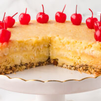 The recipe on a cake stand with pieces cut out.