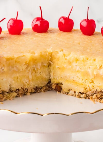 The recipe on a cake stand with pieces cut out.