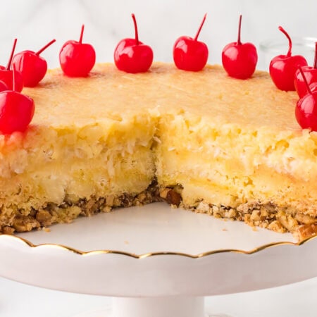 The recipe on a cake stand with pieces cut out.