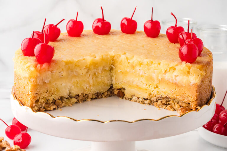 The recipe on a cake stand with pieces cut out.