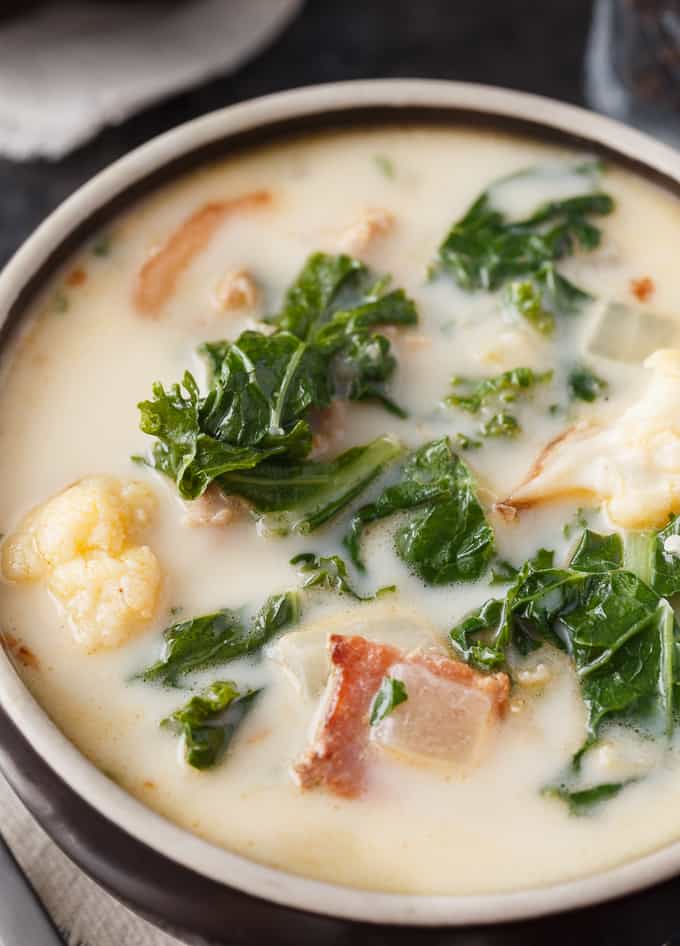 Keto Zuppa Toscana - A keto friendly version of the famous Tuscan soup! It's filled with kale, bacon, sausage, roasted cauliflower immersed in a creamy broth.