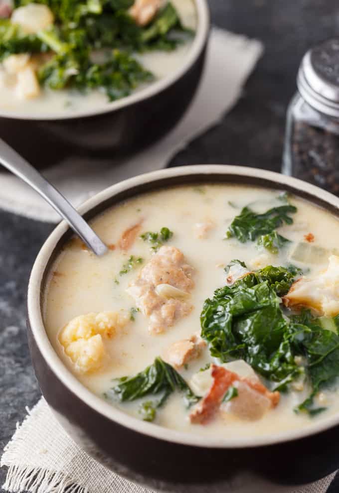 Keto Zuppa Toscana - A keto friendly version of the famous Tuscan soup! It's filled with kale, bacon, sausage, roasted cauliflower immersed in a creamy broth.