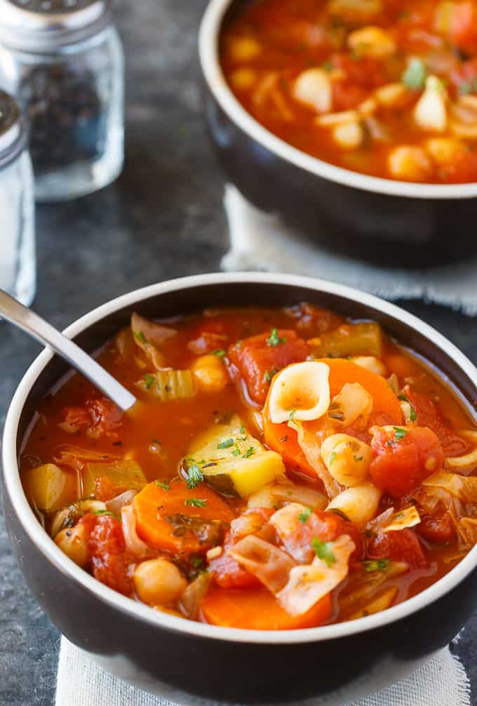 Minestrone Soup - Comfort food in a bowl. This easy family recipe is full of yummy veggies, chickpeas and baby shell pasta. So much flavor!
