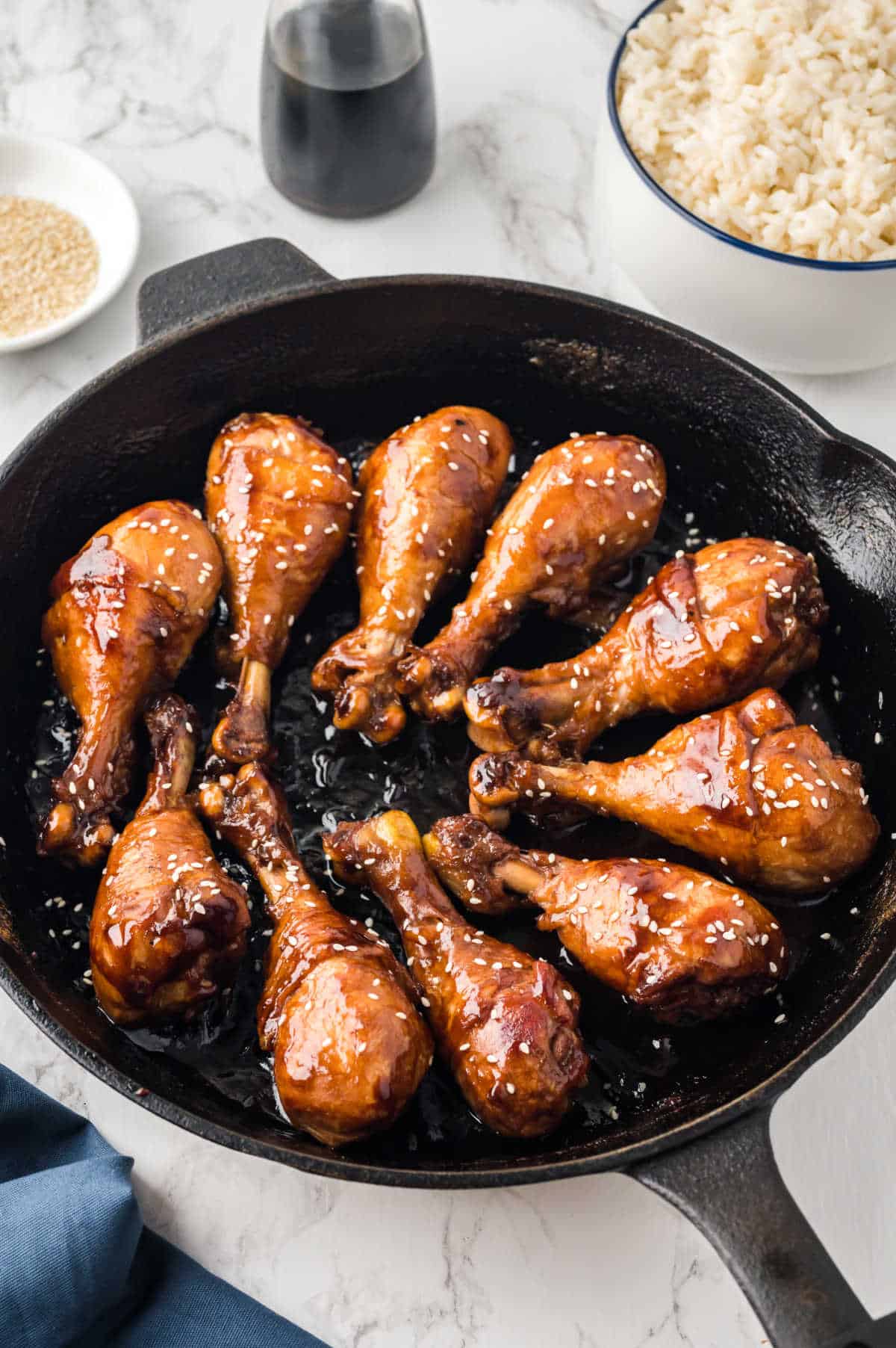 Sticky chicken in a cast iron skillet.