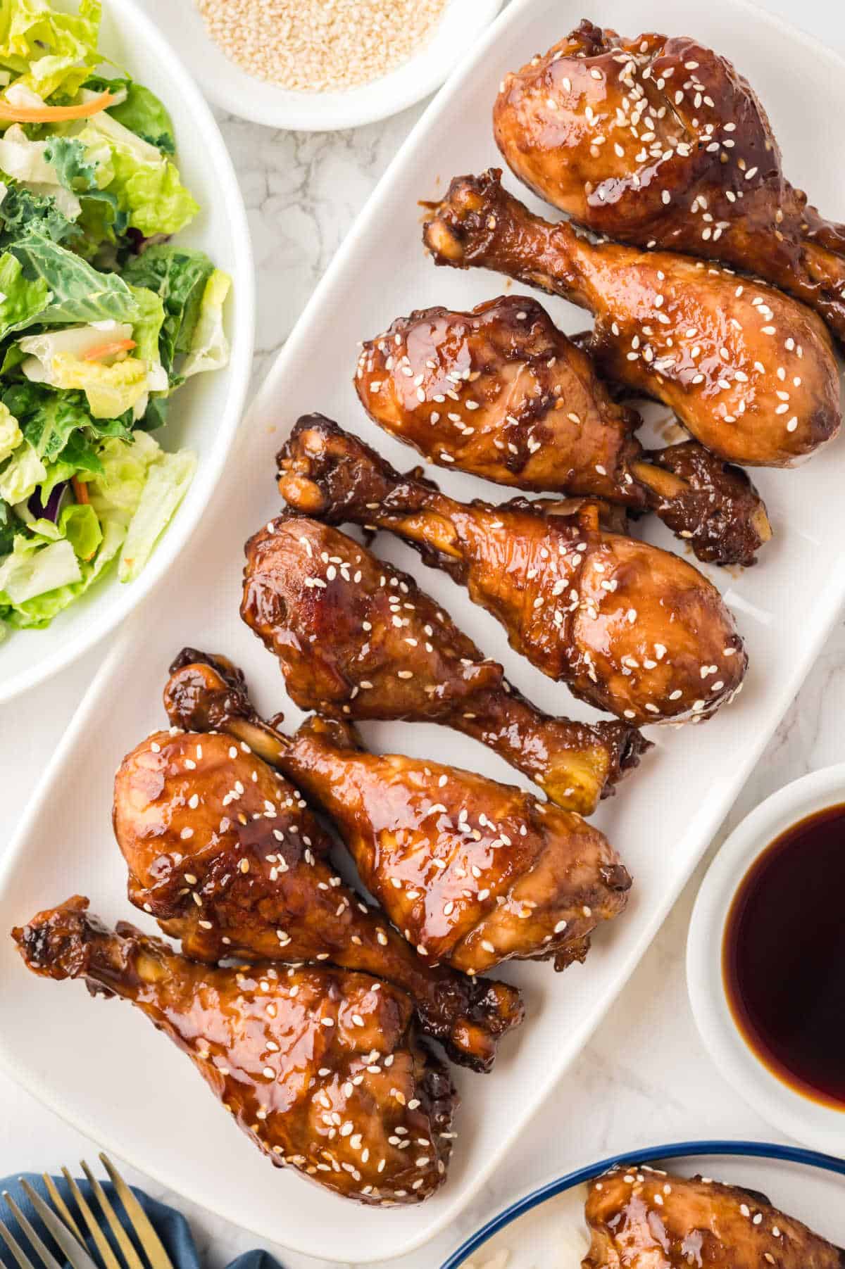 Sticky Chicken on a white platter.