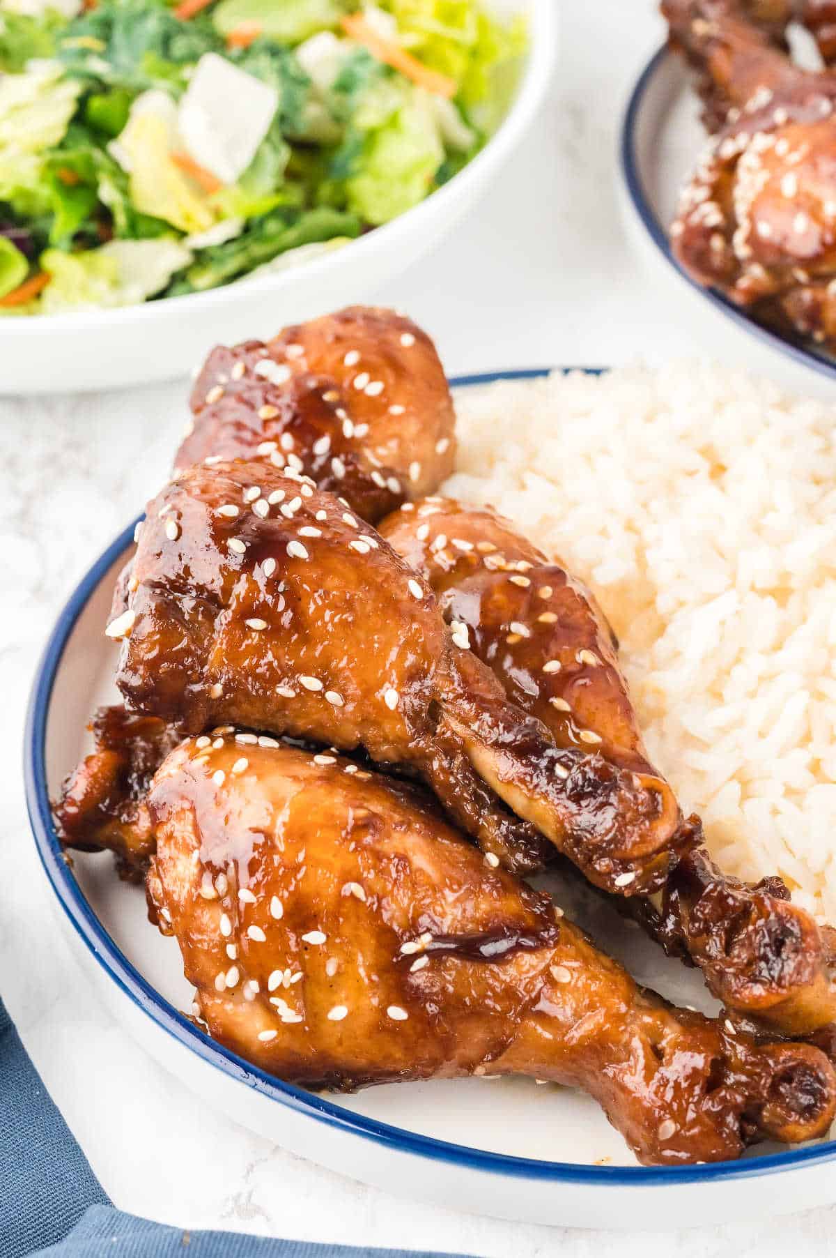 Sticky Chicken on a plate with rice.