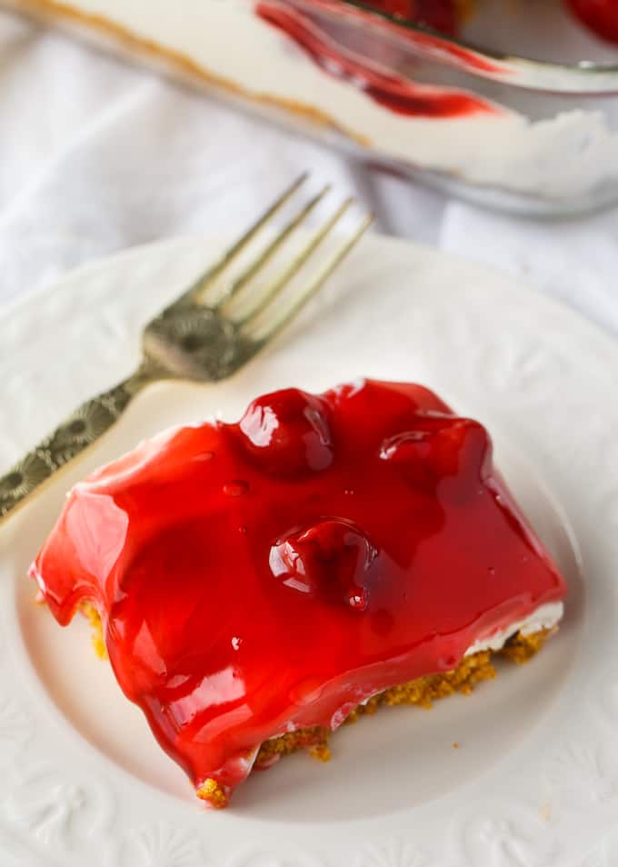 No-Bake Cherry Cheesecake - Deliciously simple no-bake cheesecake that can be whipped up in a matter of minutes! You'll love the sweet graham cracker crumb crust, creamy cheesecake filling and fruity topping.