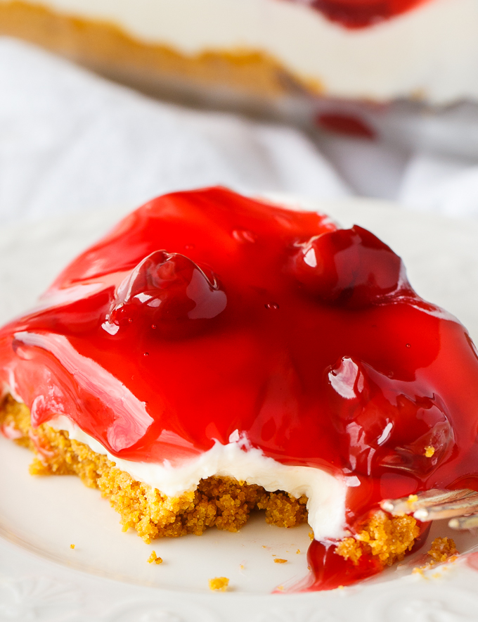 No-Bake Cherry Cheesecake - Deliciously simple no-bake cheesecake that can be whipped up in a matter of minutes! You'll love the sweet graham cracker crumb crust, creamy cheesecake filling and fruity topping.
