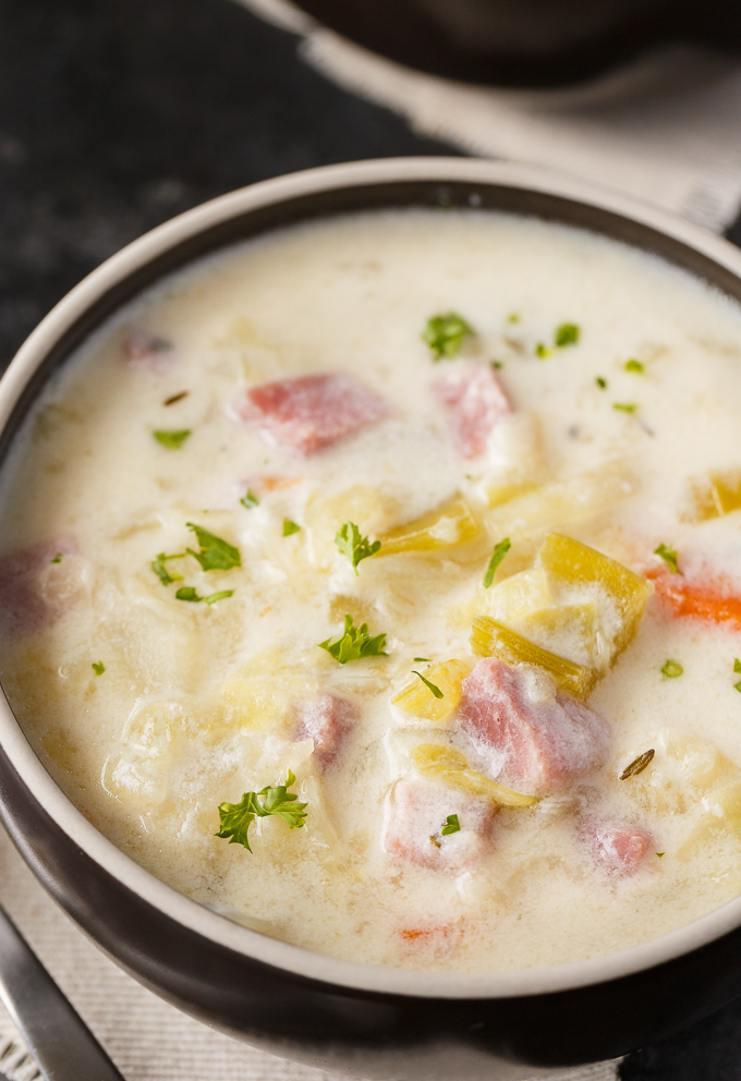 Creamy Cabbage Soup - Hearty and comforting! This delicious and easy soup recipe is loaded with tender cabbage, carrots, celery, ham and spices. Yum!