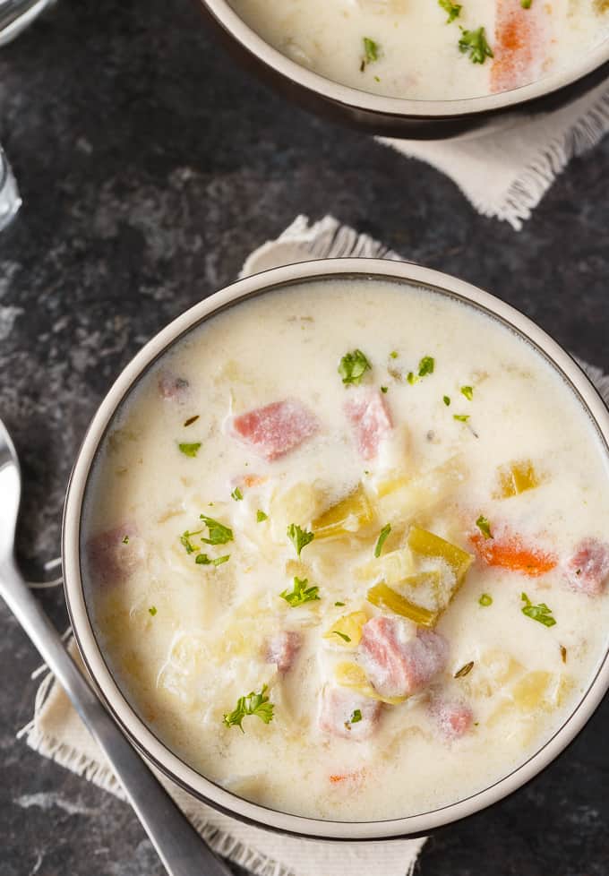 Creamy Cabbage Soup - Hearty and comforting! This delicious and easy soup recipe is loaded with tender cabbage, carrots, celery, ham and spices. Yum!