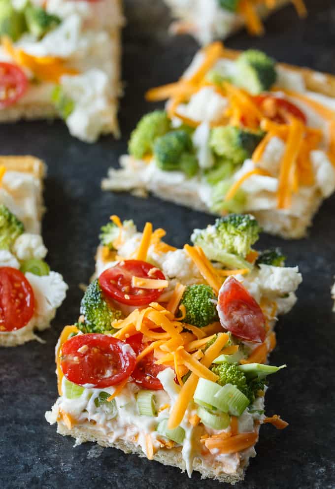 Vegetable Pizza - This easy appetizer is perfect for parties and potlucks. It's made with crescent roll dough, ranch dressing mix and loads of fresh, crispy veggies. Yum!