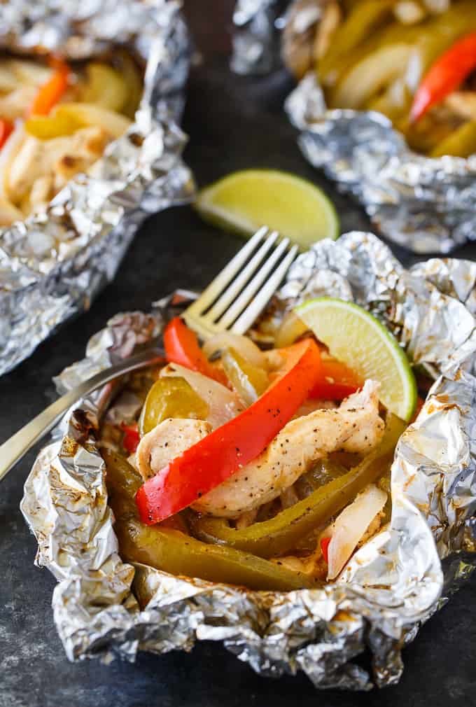 Chicken Fajita Foil Packets - Flavor packed and low carb! This easy grilling recipe is made with tender chicken, peppers and onions seasoned with the yummy tastes of fajitas.